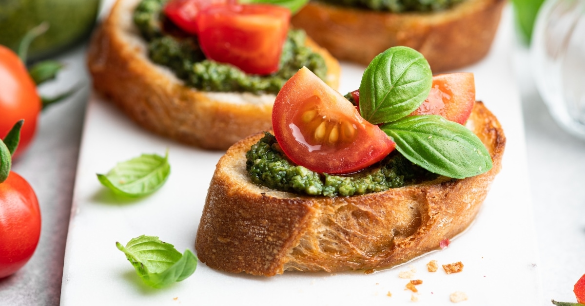 Appetizing Bruschetta with Pesto, Tomatoes and Basil