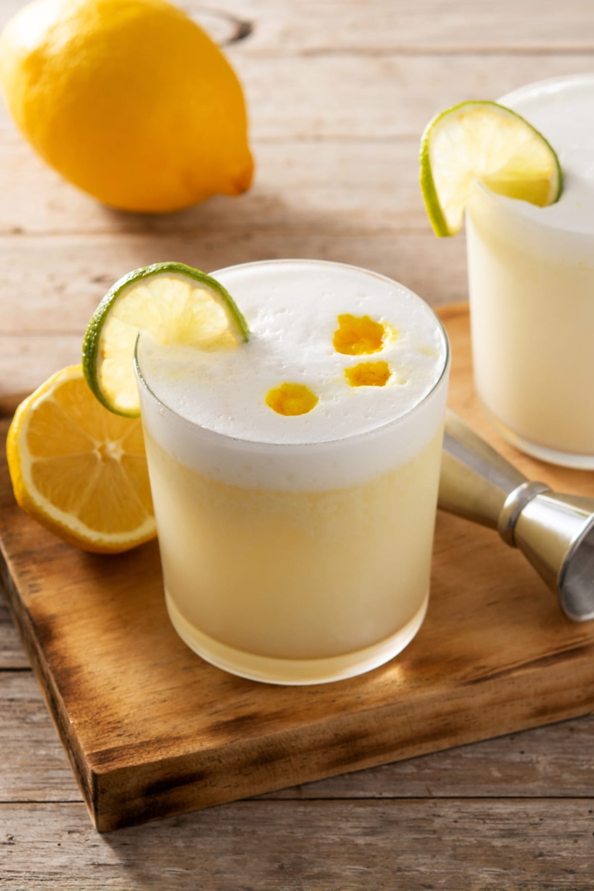 Boozy Refreshing Pisco Sour Cocktails with Lime and Lemons