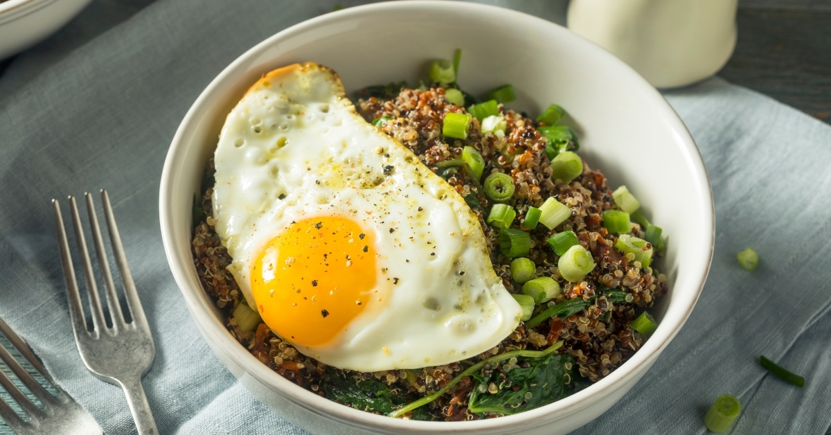 Bowl of Homemade Breakfast Quinoa with Onions and Egg