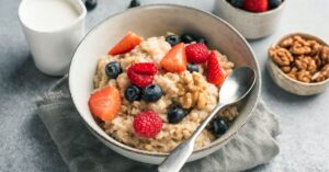 Bowl of Oat Bran Porridge with Berries and Nuts