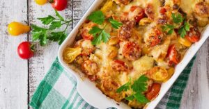 Cheesy Zucchini and Mushroom Casserole with Cherry Tomatoes