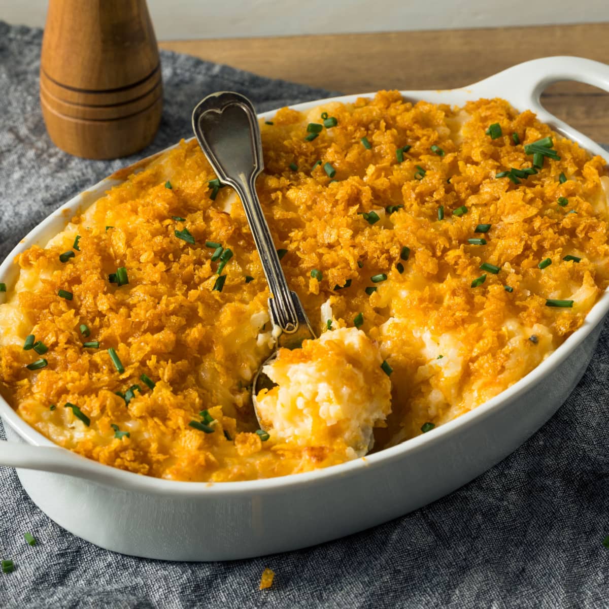 Cheesy Potato Casserole in An Oval Baking Dish