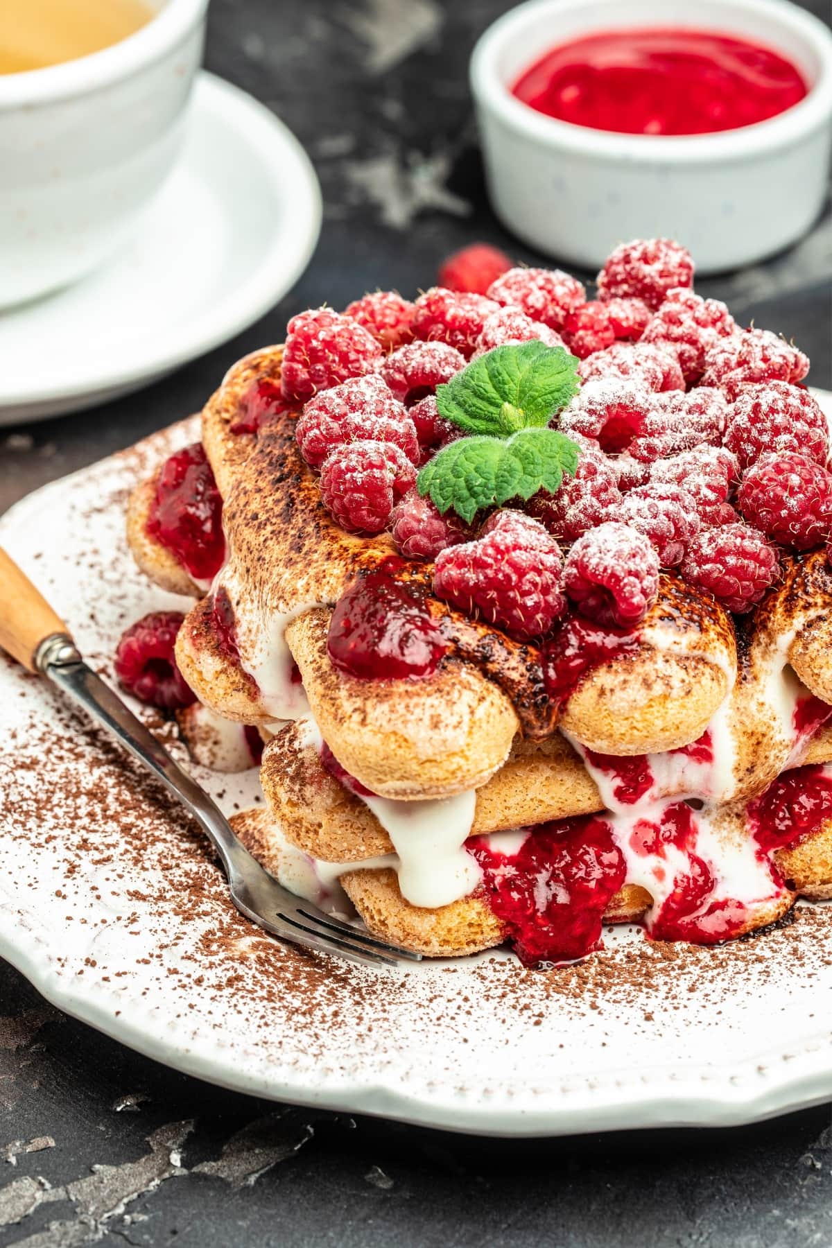 Classic Tiramisu with Raspberry and Mint Leaves