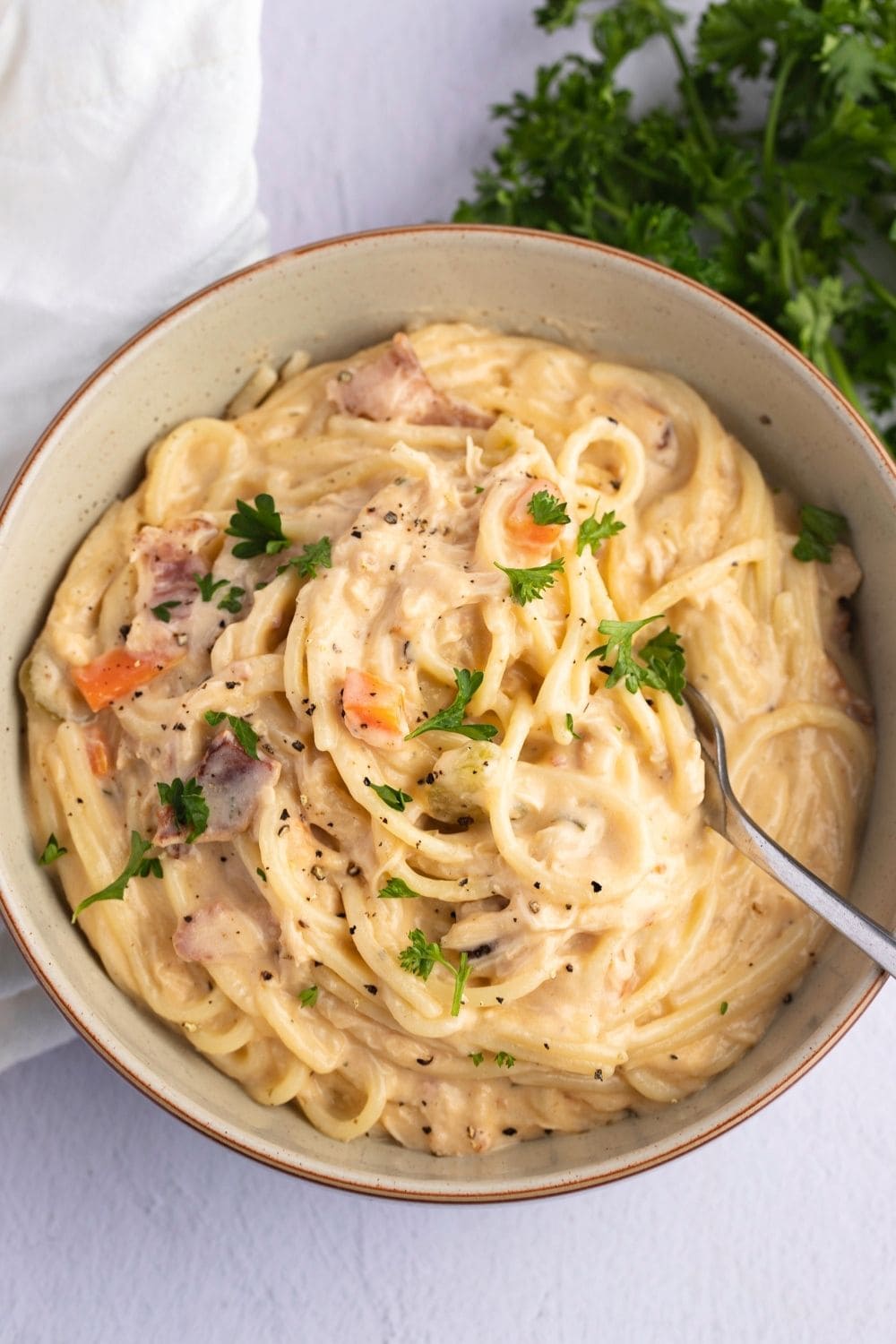 Easy Crack Chicken Noodle Soup (Best Recipe) featuring Creamy and Cheesy Crack Chicken Noodle Soup in a Bowl with a Spoon