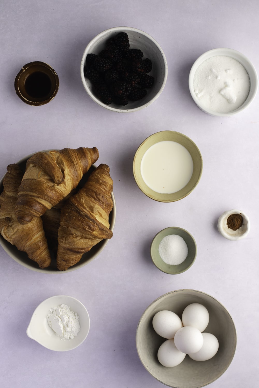 Croissant French Toast Ingredients: Croissants, Half-and-Half, Vanilla Extract, Cinnamon, Eggs, Blackberry Syrup and Toppings