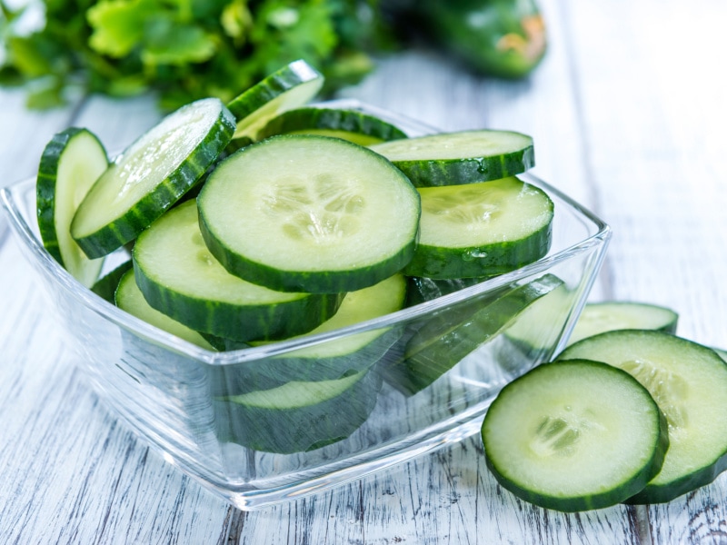 Heap of Slice Cucumbers on a Clear Bowl