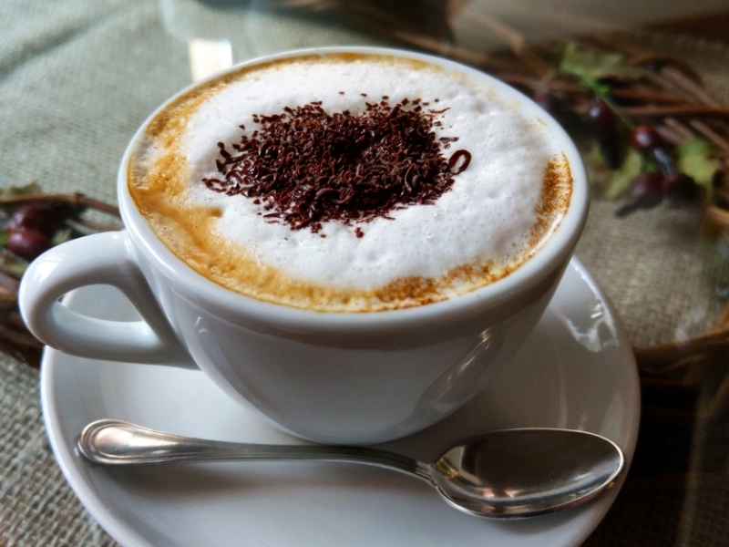 Cup of Foamy Cappuccino on a White Mug 