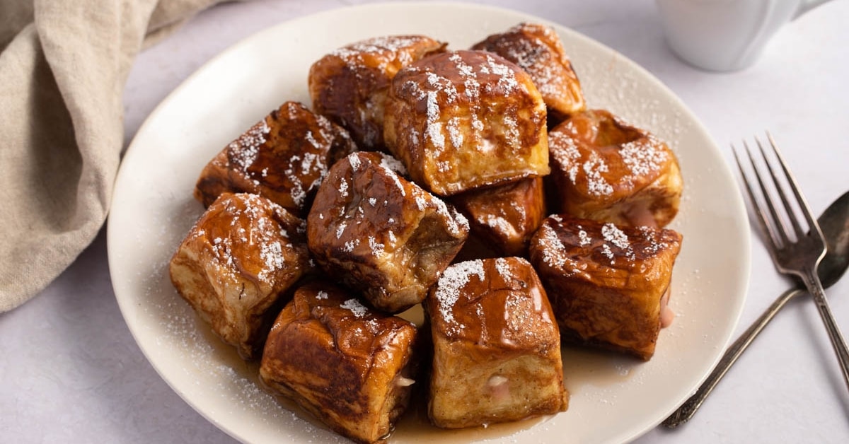 Hawaiian Roll French Toast Filled with Cream Cheese and Jam Topped with Powdered Sugar