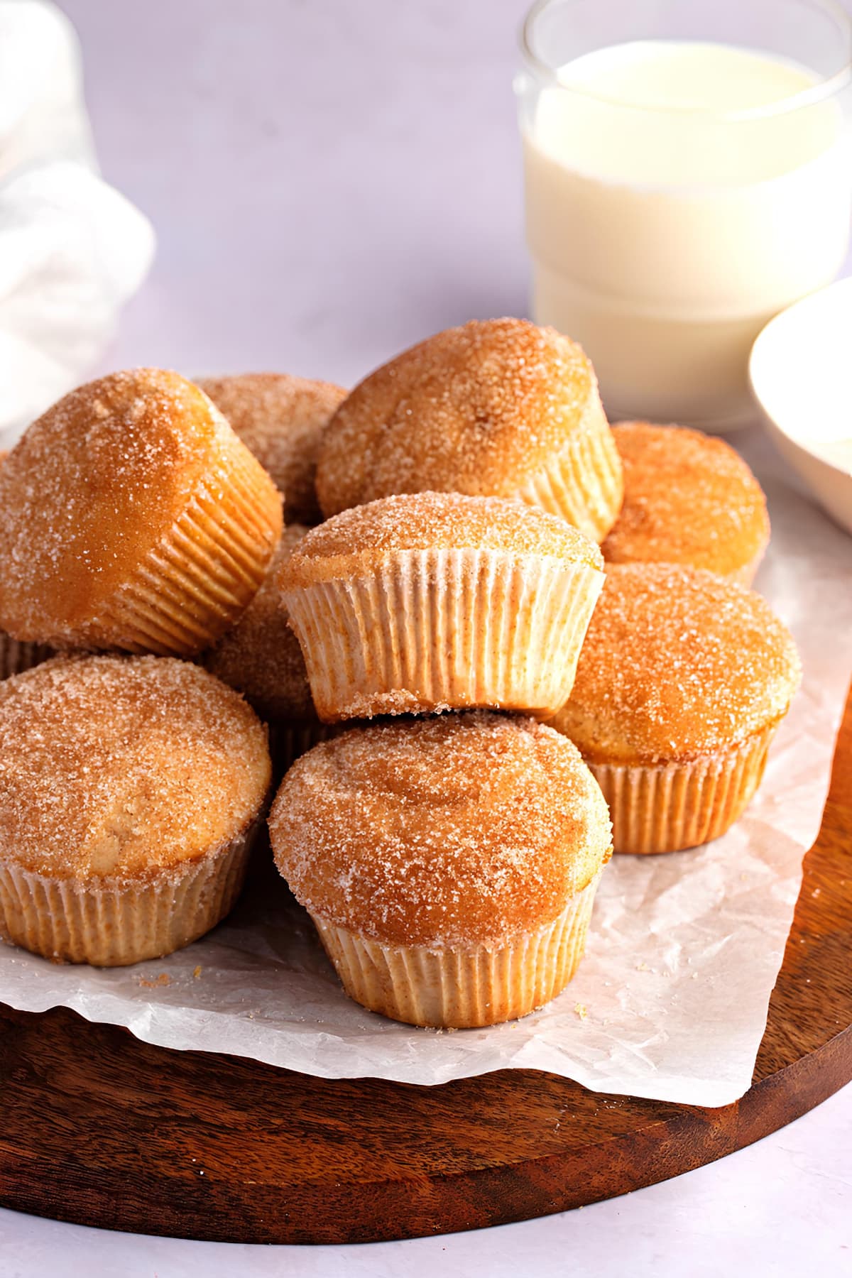 Homemade Cinnamon Muffins on a Wooden Board