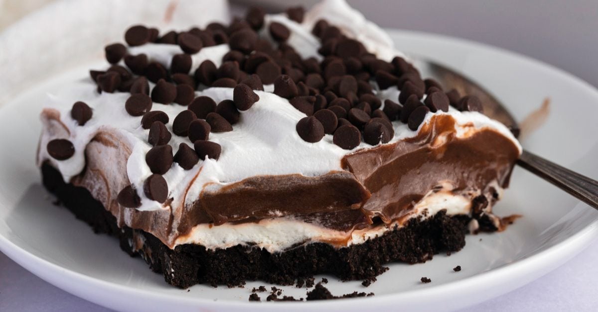 Homemade Oreo Lasagna with Chocolate Chips in a White Plate