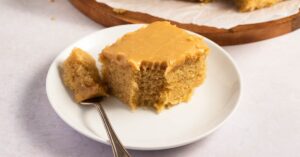 Homemade Sliced Sweet Peanut Butter Cake on a White Plate