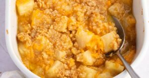 Homemade Sweet and Savory Paula Deen Pineapple Casserole with Shredded Cheese