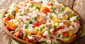 Homemade Tuna Fish and Rice with Tomatoes, Corn and Green Peas in a Bowl