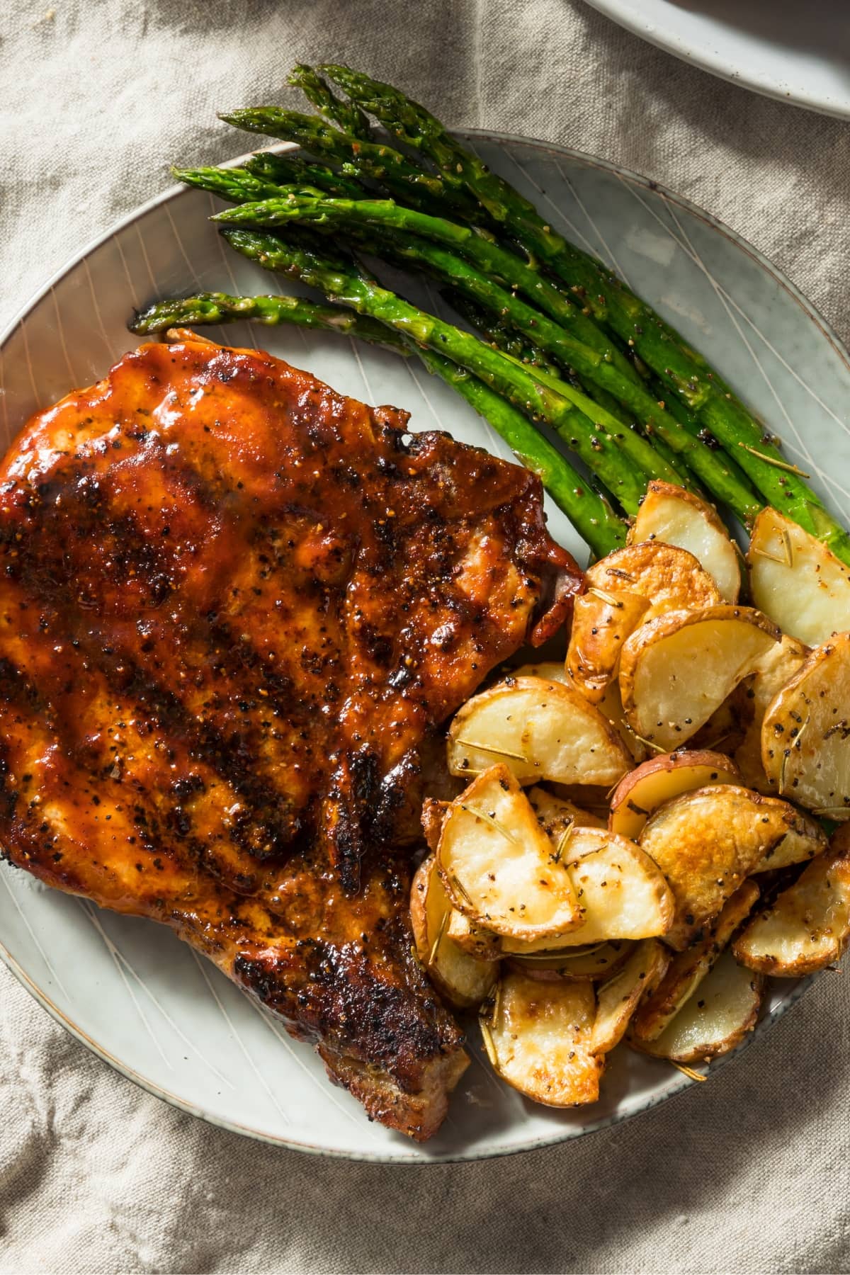 Homemade Honey Garlic Pork Chops with Asparagus and Baked Potatoes