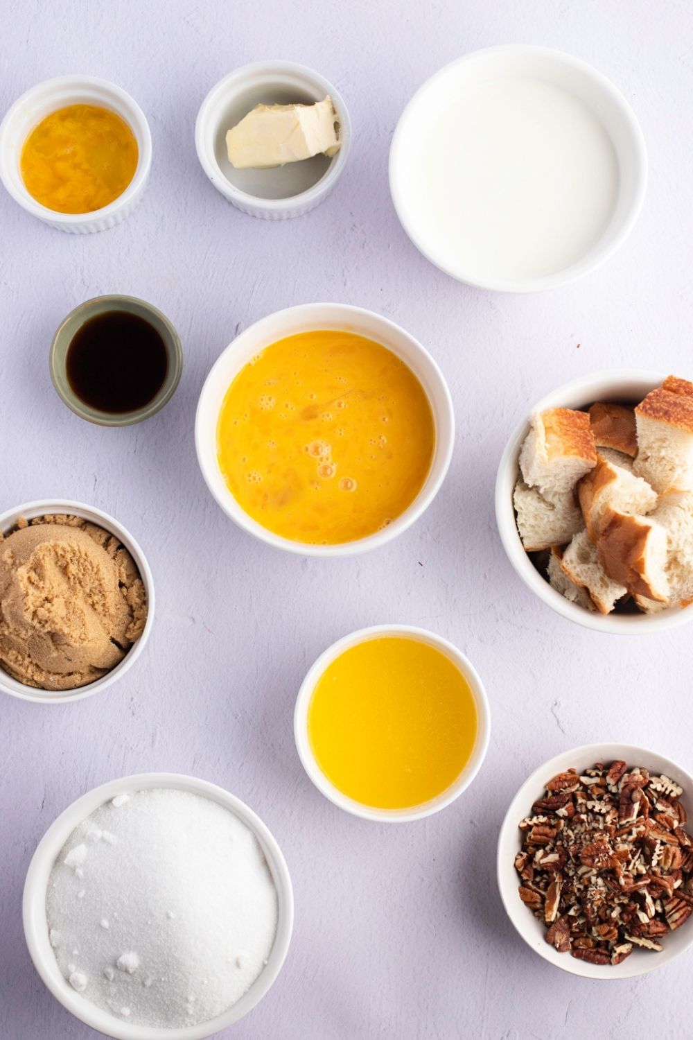 Paula Deen Bread Pudding Ingredients - Sugar, Eggs, Milk, Vanilla Extract, Bread, Butter and Pecans