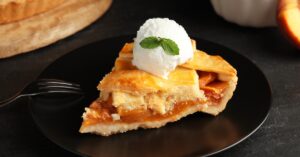 Sliced Peach Pie with Ice Cream on Top