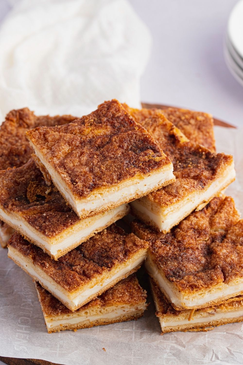 Best Sopapilla Cheesecake Bars (Easy Recipe) featuring Stack of Sopapilla Cheesecake Bars