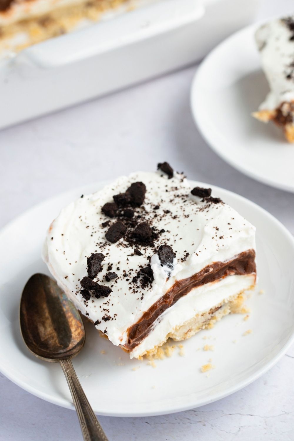 Best Ever Sex in a Pan (Easy Dessert Recipe) featuring Sweet and Delightful Sex in a Pan with Creamy Layers of Chocolate, Vanilla, Cream, and Oreo Cookies