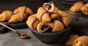 Sweet Homemade Crescent Rolls Filled with Chocolate Syrup