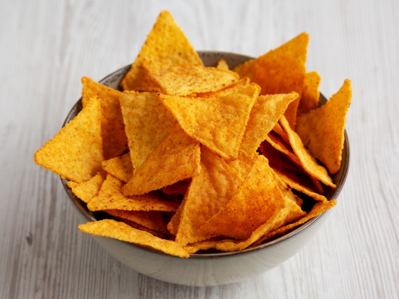 A Bowl of Tortilla Chips on a Wooden Table