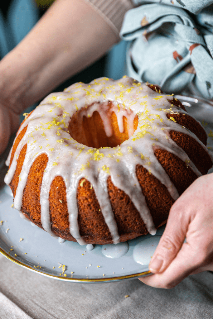 Woman Holding a Bundt Lemon Sour Cream Cake